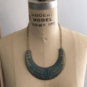 Necklace with turquoise and gold design.